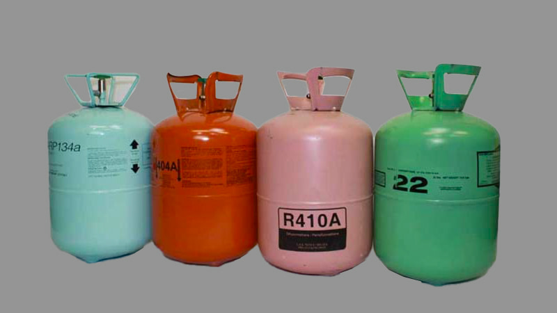 Various refrigerant cylinders with different labels like R-410A, R-32, R-1234yf