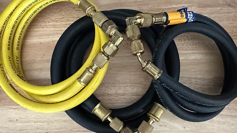 A close-up of a premium, large-diameter HVAC hose with its specifications, including PSI and vacuum rating, clearly printed on the side