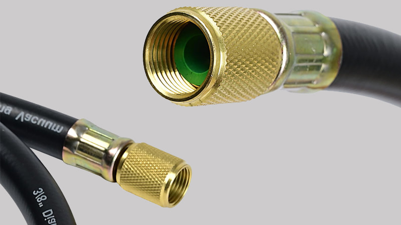 A macro close-up shot of the high-quality brass flare fitting on a dedicated vacuum hose, with a focus on the clean, black rubber gasket inside the depressor