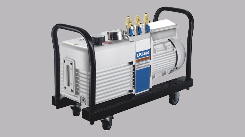 An Elitevak industrial vacuum pump on a sturdy trolley, showing its multiple inlet ports and robust, heavy-duty construction, ready on a job site