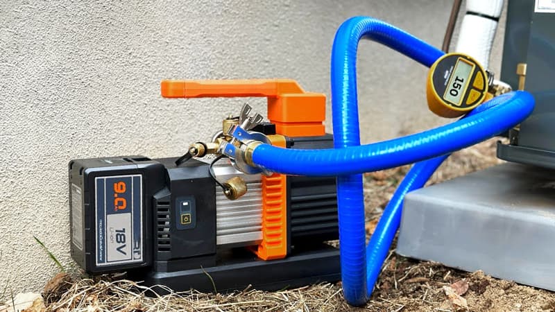 The next step in the process: a vacuum pump is now connected to the HVAC system where the recovery machine was previously