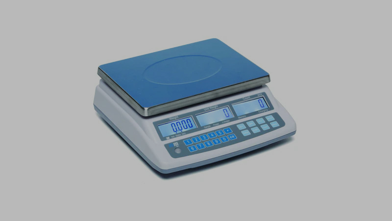 Side-by-side comparison: a dedicated refrigerant scale and a common household or postal scale