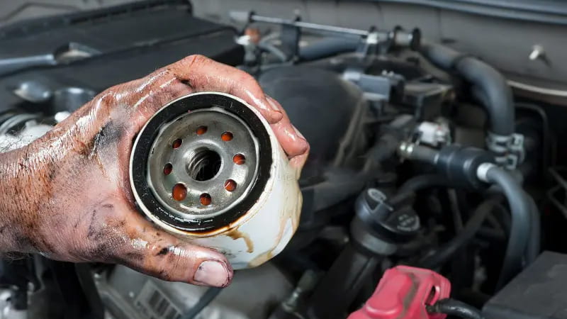 Technician Holding a Dirty Clogged Filter