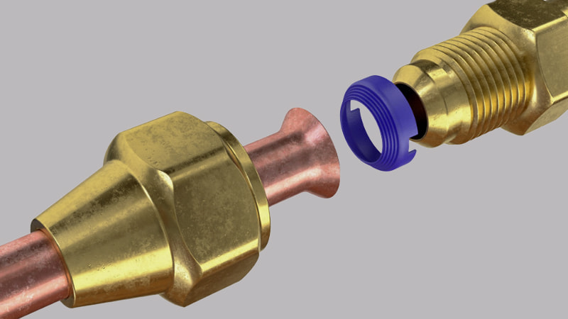 A technician using a wrench to carefully tighten a flare nut connection on an HVAC lineset